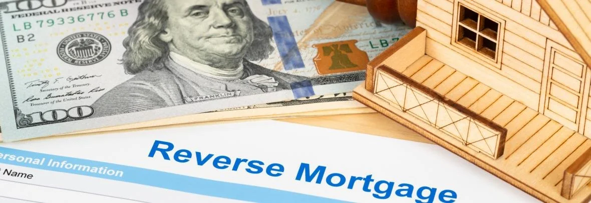 Reverse mortgage paperwork with a model home