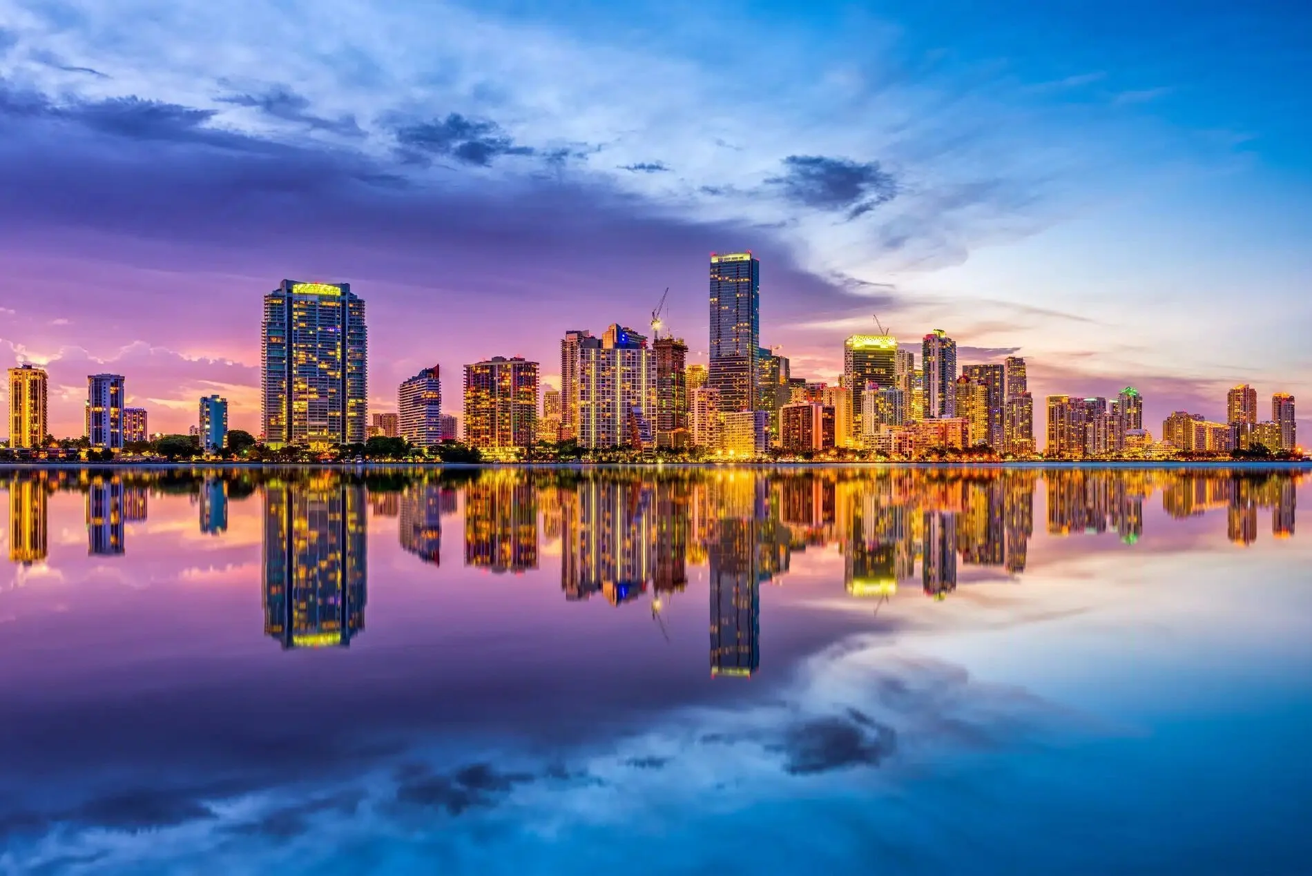 Miami skyline reflected in the water at sunset