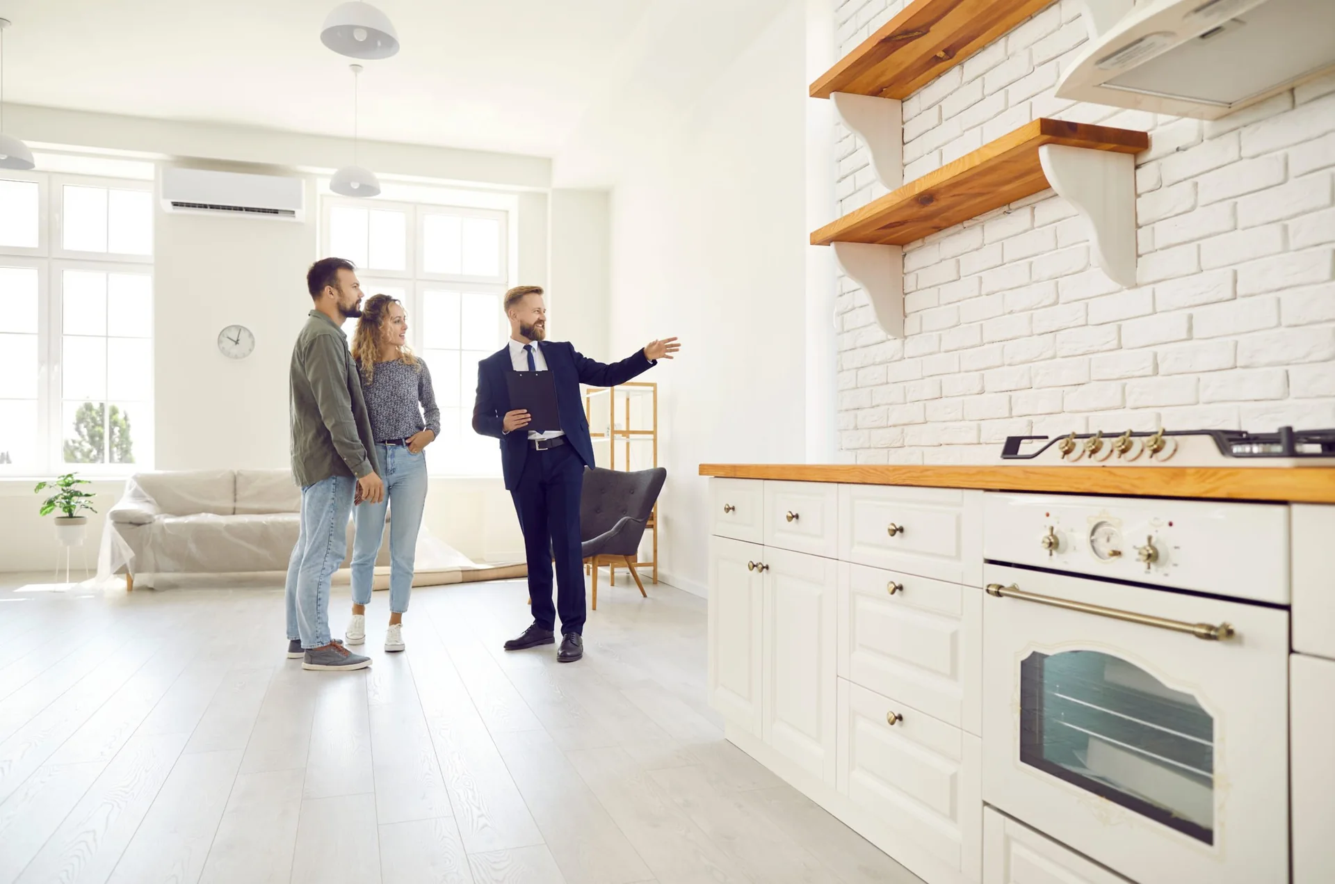 Real estate agent showing a kitchen