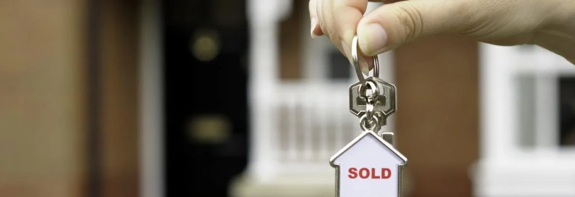 House keys with a sold tag